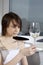 Young woman taste white wine