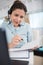 young woman telephone operator agent with headset working in office