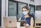 Young woman telephone operator with headset wear protection face mask against coronavirus, Customer service executive team working