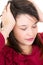 Young woman thinking and stressed hands on head