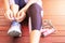 Young woman tie shoelace before exercise jump rope