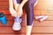 Young woman tie shoelace before exercise jump rope