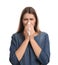 Young woman with tissue suffering from runny nose on white background