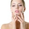 Young woman touching her face and neck. Beauty treatment for young beautiful female face. Skin care, beautician treatments, body