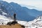 Young woman tourist backpacker standing rock mountain edge.