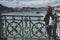 Young woman tourist enjoying panoramic view Danube river and Liberty Bridge. Budapest. Hungary.