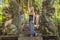 Young woman tourist explores the Monkey Forest in Ubud, Bali, In