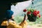 Young Woman Tourist Lady Photographs A Hanging Flower Pot On Phone