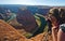 Young woman tourist photographer in grand canyon