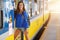 Young woman tourist at platform train station