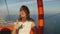 Young woman tourist sitting in cable car on the way to the top of the Kunektepe Teleferik