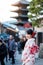 Young woman tourist wearing kimono enjoy in Yasaka pagoda area near Kiyomizu dera temple, Kyoto, Japan. Asian girl with hair style