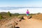 Young woman trail running in mountains