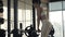 Young woman training incline with fitness equipment front of mirror on gym club
