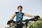 Young woman training on mountain bike and cycling in park