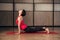 Young woman training yoga - upward facing dog