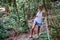 Young woman travel solo in Thailand jungle