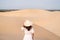 Young woman traveler enjoying at white sand dunes in Vietnam, Travel lifestyle concept