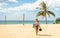 Young woman traveler walking on the beach in Phuket island