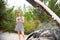 Young woman traveling on the car in sunny day