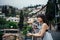 Young woman traveling to Italy.Visiting Taormina,Sicily,Italy.Woman traveler enjoying charming Mediterranean coastal city.