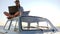 Young woman travels, using powered by solar cell for computer on background beach sitting on vintage car in sunlight