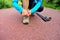 Young woman tying shoelace outdoor