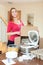 Young woman upacking electric slow cooker in kitchen at home