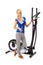 Young woman uses elliptical cross trainer.