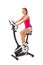 Young woman uses stationary bicycle trainer.