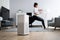 Young Woman Using Air Humidifier