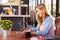 Young woman using computer at a coffee shop