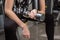 Young woman using dumbbell