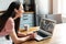 A young woman using laptop for video call, zoom