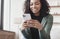 Young woman using smartphone at home. Student girl texting on mobile phone in her room. Communication, leisure lifestyle concept