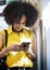 Young woman using a smartphone in the subway