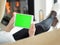 Young woman using tablet computer in front of fireplace