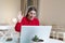 Young woman on a video call from home with her friends while in quarantine. Cropped shot of an attractive young woman using her