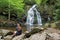 Young Woman Viewing Spruce Flats Falls