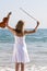 Young woman with violin on beach