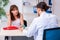 Young woman visiting male doctor gastroenterologist