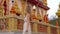 Young woman visiting a Wat Chalong temple on Phuket island, Thailand