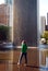 A young woman wades in the waters of the Crown Fountain