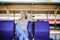 Young woman waiting in vintage train, relaxed and carefree at the station platform in Bangkok, Thailand before catching a train.