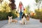 Young woman walking adorable dogs