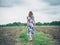 Young woman walking in barren field