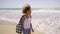 Young Woman Walking On The Beach.