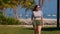 Young woman walking on a Carribean Paradise beach