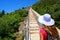 Young woman walking on the defensive wall of Ston town, Peljesac Peninsula, Croatia