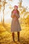 Young woman walking in the fall season. Autumn outdoor portrait